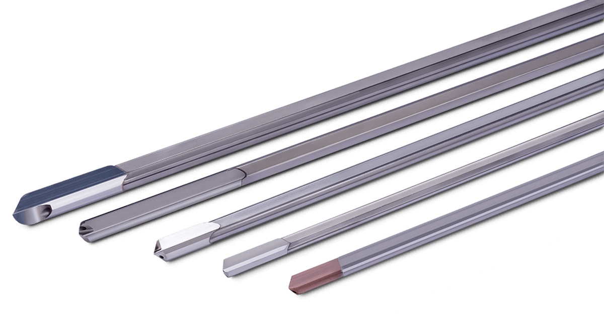 A row of five single-flute gundrills of varying diameters showing their angled cutting tips